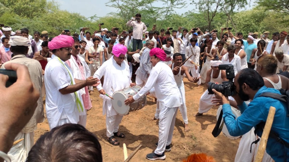 Independent MLA Ramkesh Meena (centre) plays the dhol at Amagarh fort | By special arrangement