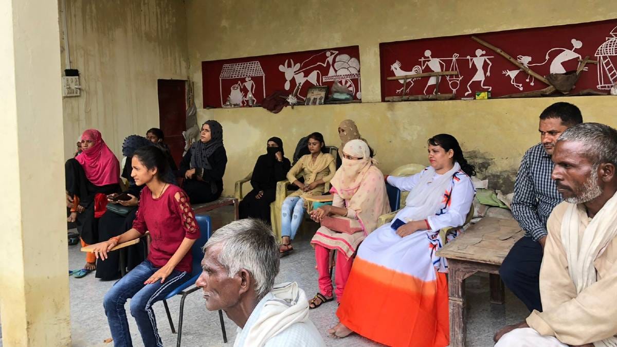 Survivors of abuse wait for their turn to discuss their cases with the Chingari Adalat representatives | Jyoti Yadav | ThePrint