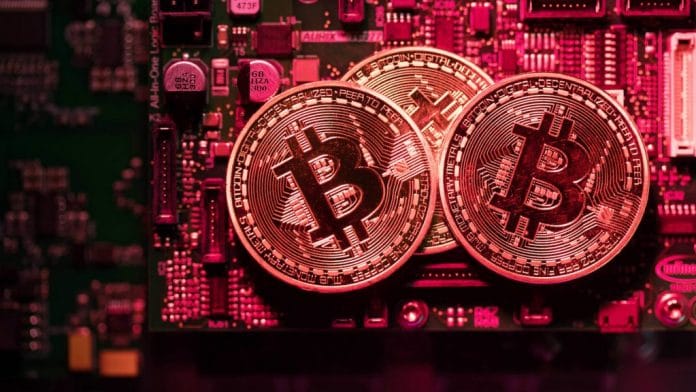 A pile of coins representing Bitcoin cryptocurrency | Photo: Chris Ratcliffe | Bloomberg