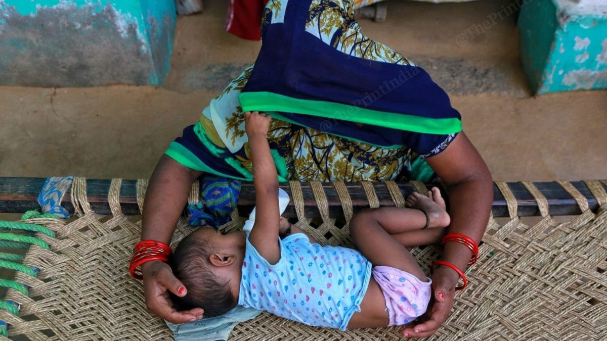 The girl’s mother with her youngest grandchild who turned one on 26 August | Photo: Manisha Mondal/ThePrint