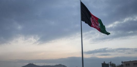 An Afghan flag flying on a hilltop in Kabul | File photo: Victor J. Blue | Bloomberg