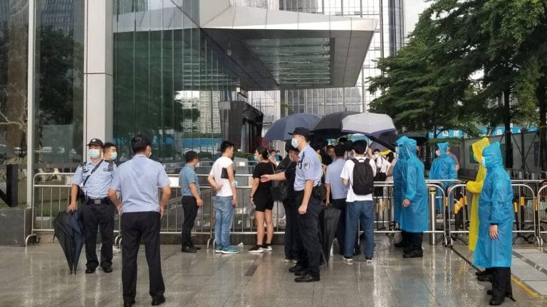 China property giant Evergrande shares tumble after protesters crowd HQ amid debt crisis