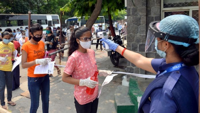 File photo of students being scanned as they arrive to appear for the NEET exam on 13 September 2020 | ANI