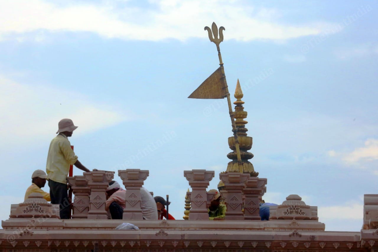 Workers carrying out work at the main gate in Kashi Vishwanath Dham Project | Photo: Praveen Jain | ThePrint