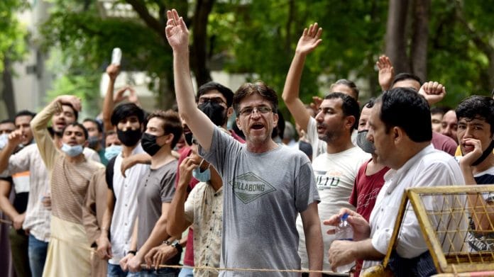 Afghan nationals shout slogans during a protest outside the UNHCR in New Delhi, on 27 August 2021 | ANI photo