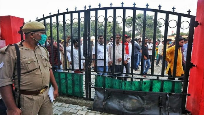 Families of those killed wait outside the mortuary of the district hospital in Lakhimpur Kheri | Photo: Praveen Jain | ThePrint
