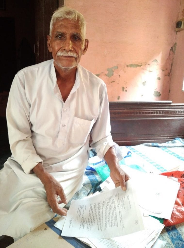 Jaipal Mithariya showing BMU’s registration papers. | Photo Credit: Shivam Mogha