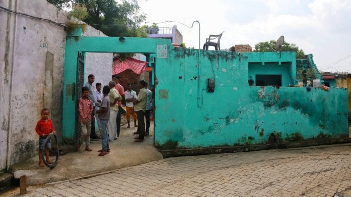 Relatives and neighbours of the 16-year-old Dalit girl outside her home at Kirra village in Bulandshahr | Manisha Mondal | ThePrint