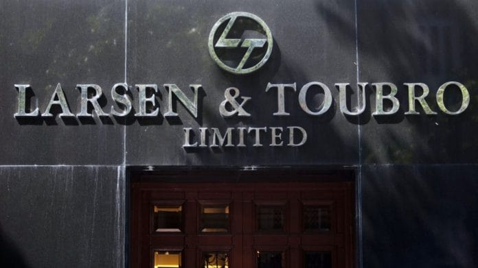 The logo of Larsen & Toubro Ltd. outside the company's headquarters in Mumbai | Photographer:Kuni Takahashi | Bloomberg