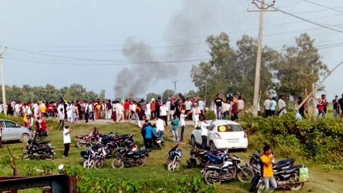 A vehicle set ablaze after violence broke out after farmers agitating were allegedly run over by a vehicle in the convoy of a union minister, in Lakhimpur Kheri on 3 October | PTI