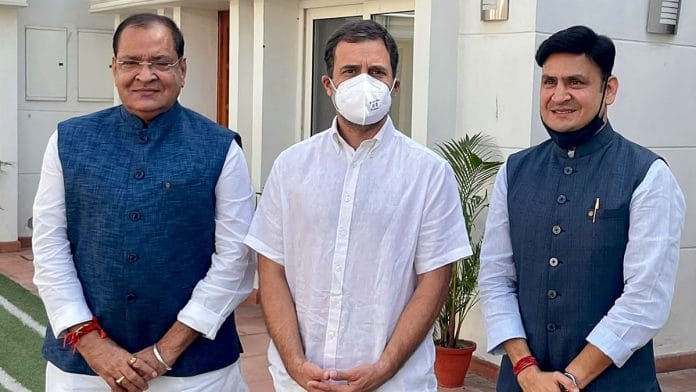 Congress leader Rahul Gandhi welcomes Yashpal Arya (left) and his son Sanjiv Arya (right) into the party in New Delhi Monday | Photo: ANI