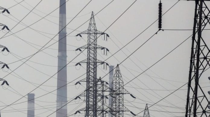 Electricity pylons near a thermal power station in Mumbai | Representational image | Bloomberg