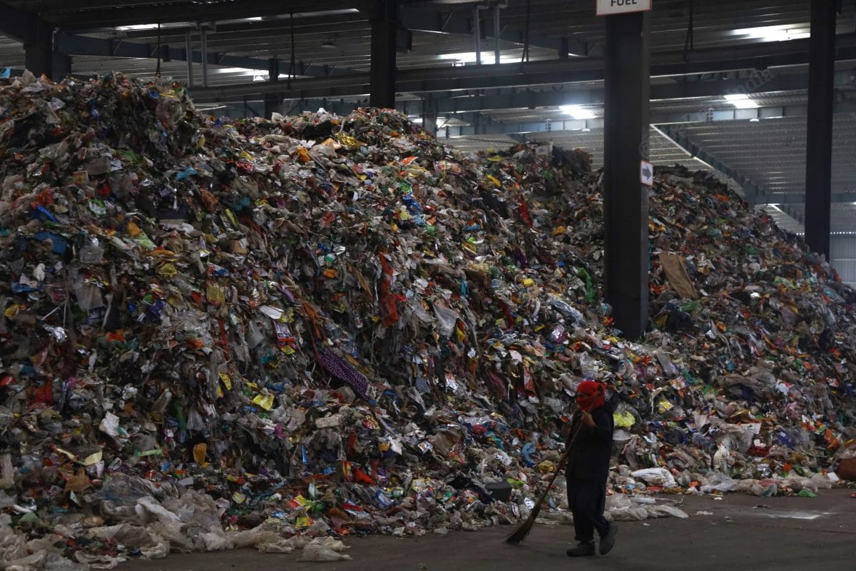 At the dumping yard a woman cleans the floor | Photo: Manisha Mondal | ThePrint