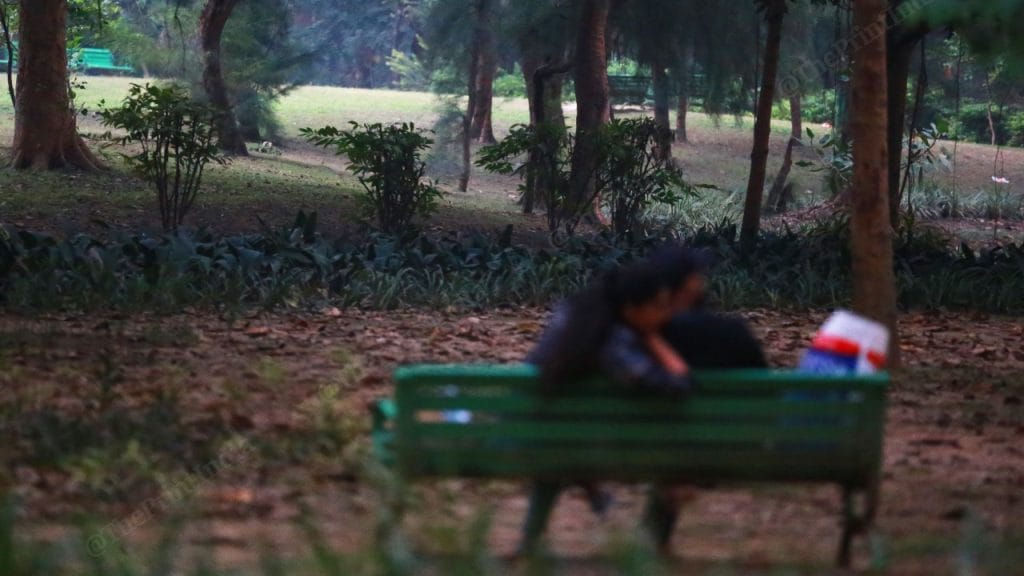 At Lodhi Garden, a couple sit on a bench in the evening | Photo: Manisha Mondal | ThePrint