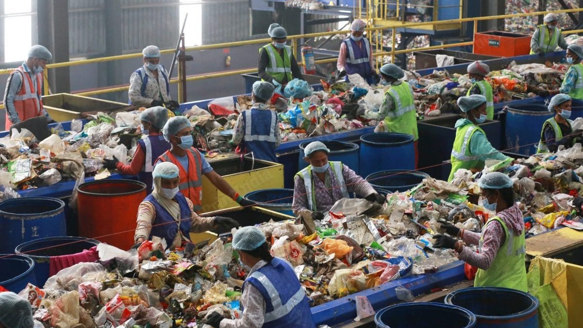 In the dumping yard, women workers segregate the waste collected from different societies of Indore | Photo: Manisha Mondal/ThePrint