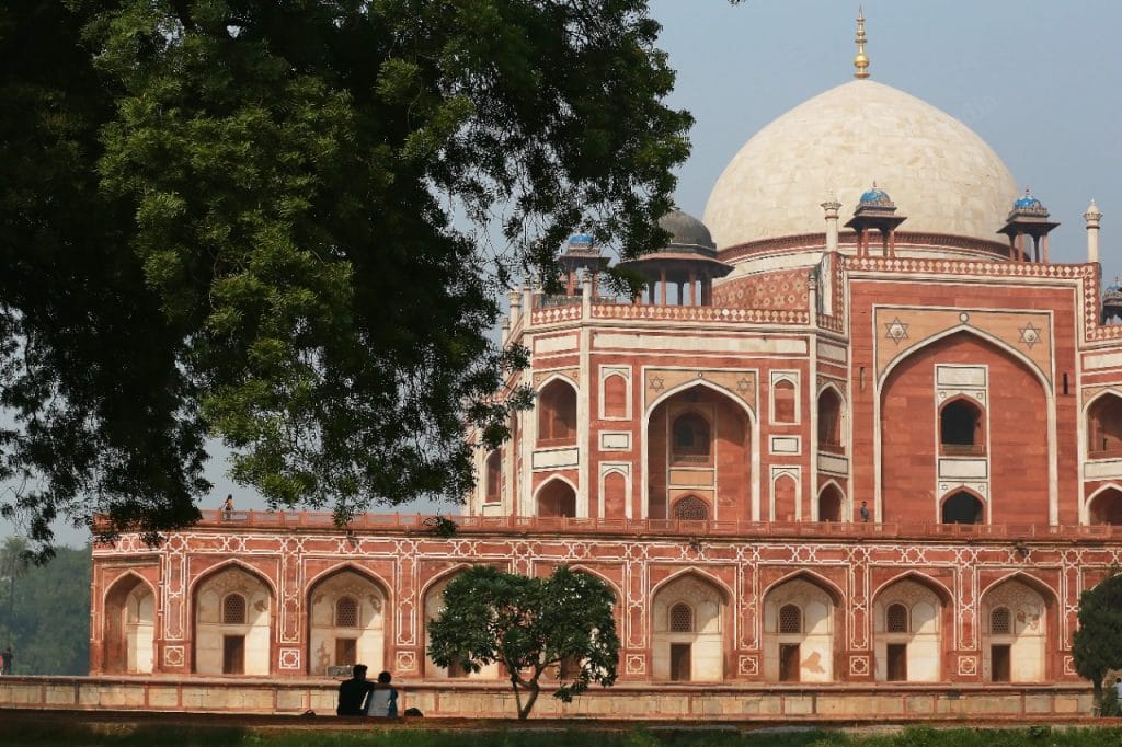 At Humayun's Tomb, a couple sit facing the monumnet | Photo: Manisha Mondal | ThePrint