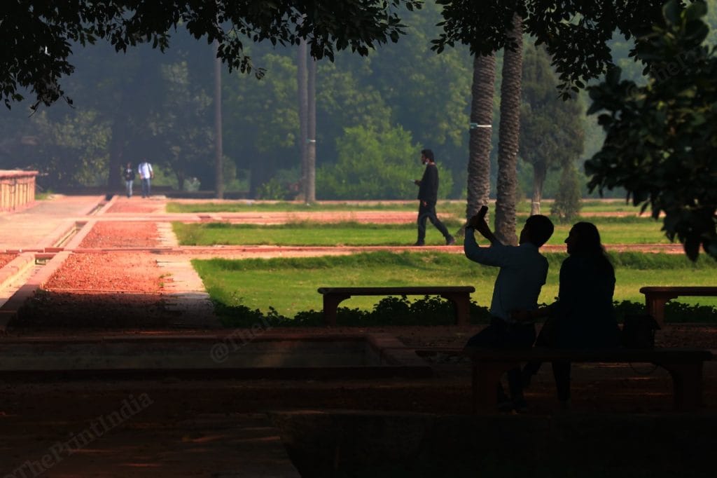 A couple click selfie at Humayun's Tomb | Photo: Manisha Mondal | ThePrint