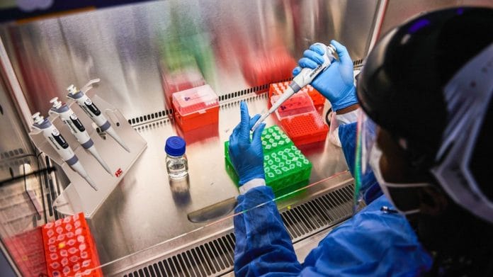 A technician uses a single channel pipette dropper at a Testaro Covid-19 laboratory in the Dunkeld suburb of Johannesburg, South Africa | Representational image | Bloomberg