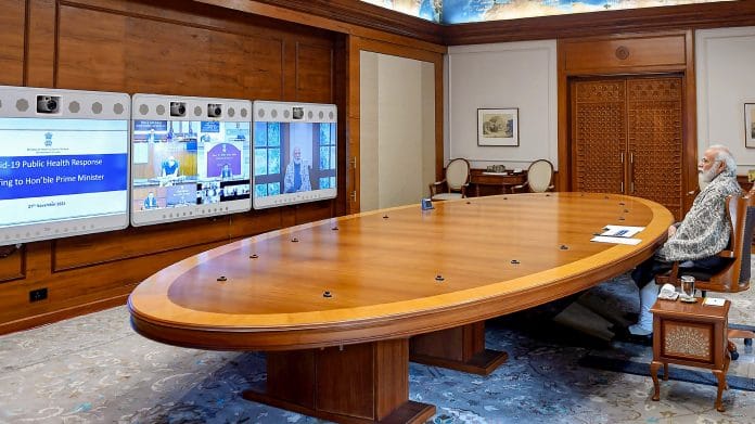 Prime Minister Narendra Modi chairs a meeting to review the Covid situation, through video conferencing, in New Delhi, on 27 November 2021 | PTI Photo