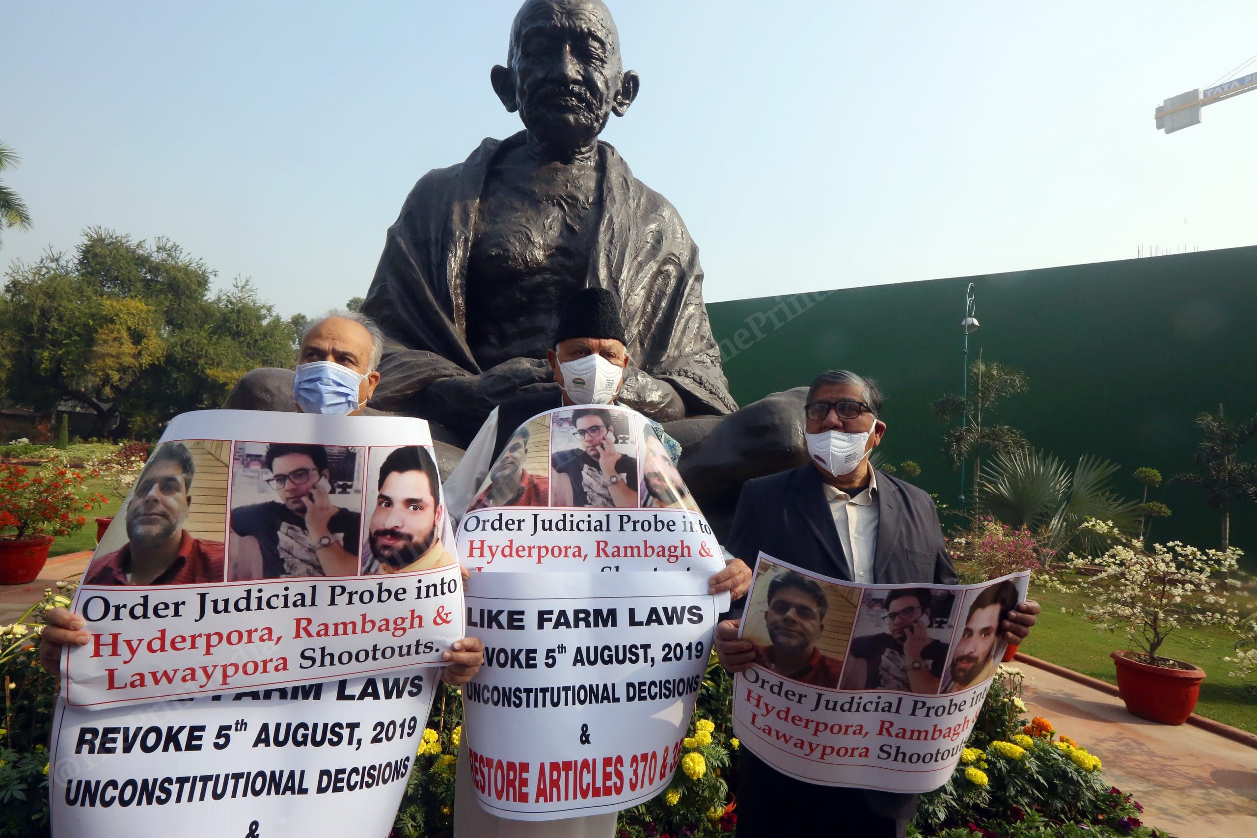 Jammu & Kashmir National Conference Farooq Abdullah along Hasnain Masoodi and Mohammad Akbar protesting on Hyderpora, Rambagh and Lawaypora shootouts at Mahatma Gandhi statue in Parliament House | Photo: Praveen Jain | ThePrint