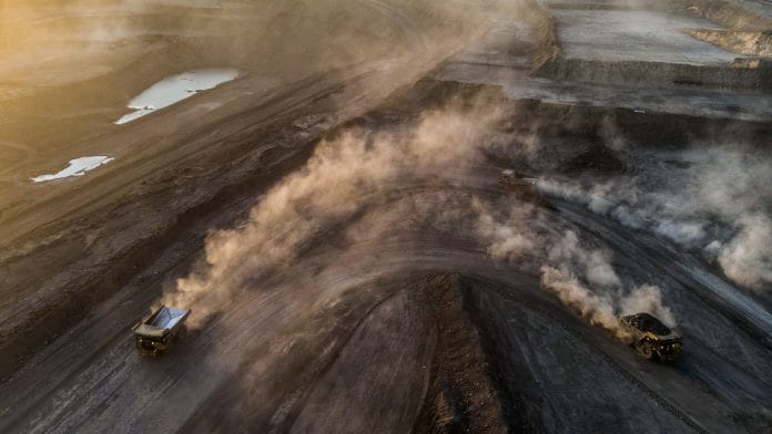 Dump trucks travel along an access ramp at the Tavan Tolgoi coal deposit | Representational image| Bloomberg