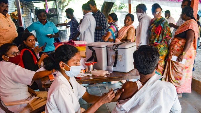 File photo of a health worker administering a dose of Covid-19 vaccine | PTI