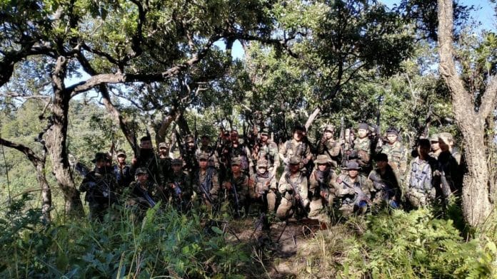 The two organisations released a statement with a picture showing a group of about 30 cadres brandishing Kalashnikov rifles | ThePrint