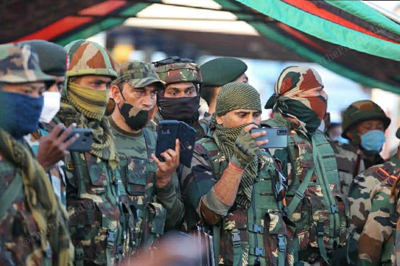 Jawans take pictures at the wreath laying ceremony at Imphal Airport | Photo: Praveen Jain | ThePrint