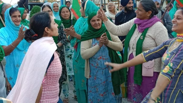 Protesters celebrate the Modi government's decision to repeal the farm laws, at a toll plaza in Patiala | By special arrangement