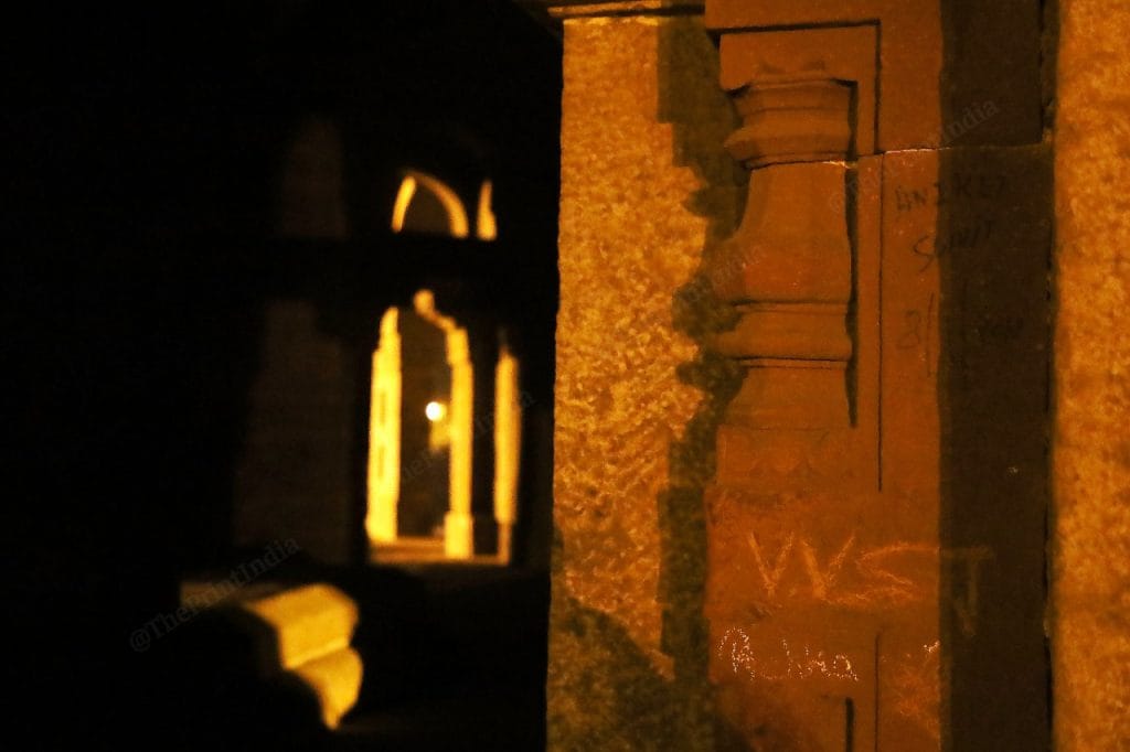 On the walls of, outside the tomb, lovers have written their names | Photo: Manisha Mondal | ThePrint