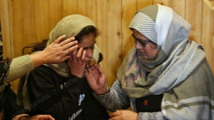 Altaf Bhatt's widow Mariyam with her daughter Nyfa grieving at their house in Srinagar. | Photo: Praveen Jain/ThePrint