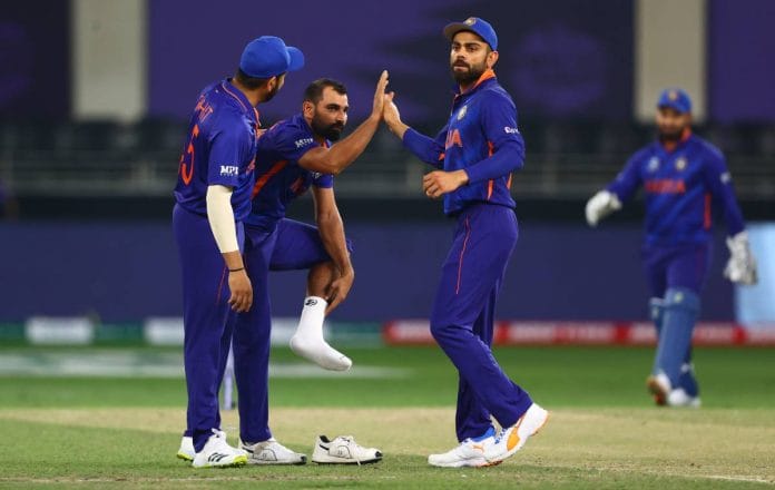 India celebrates taking a wicket during Friday's match. | Twitter | @T20WorldCup