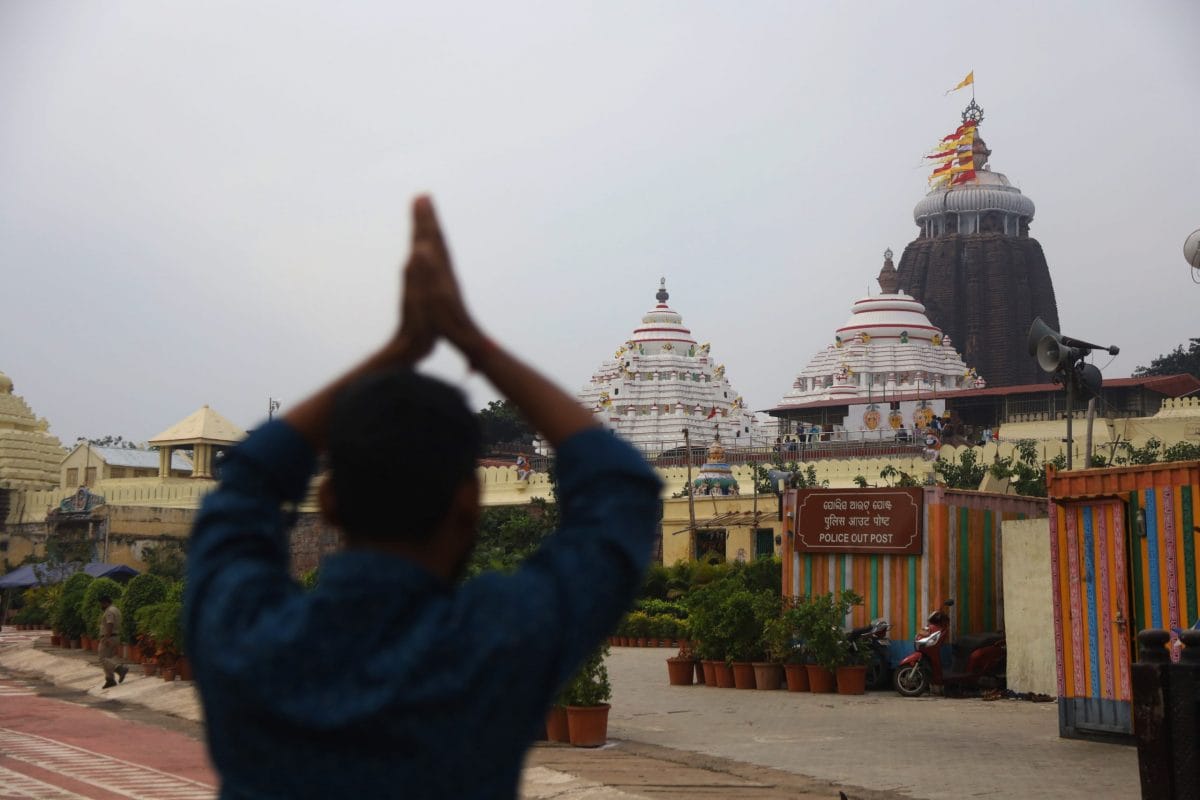 A worshipper folds hands outside Jagannath temple | Photo: Manisha Mondal | ThePrint