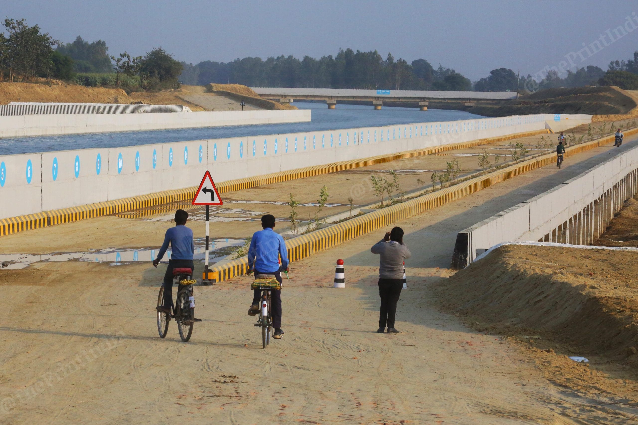 Local villagers crossing the Drainage syphon in Kharjhar Nala at Saryu Nahar Pariyojna Project | Photo: Praveen Jain| ThePrint