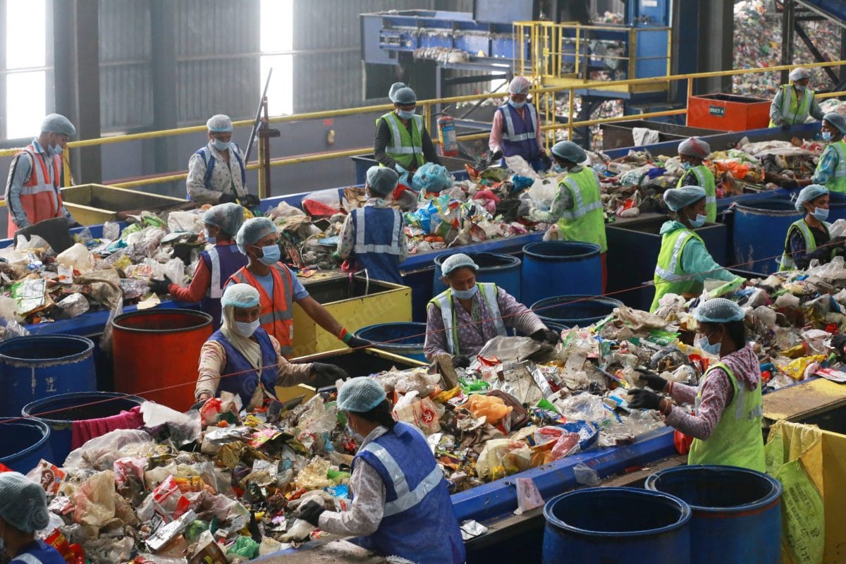 Indore was declared the cleanest city for the fifth time in the Swachh Survekshan (cleanliness survey) 2021. In this photo, workers segregate garbage in the dumping yard | Photo: Manisha Mondal | ThePrint