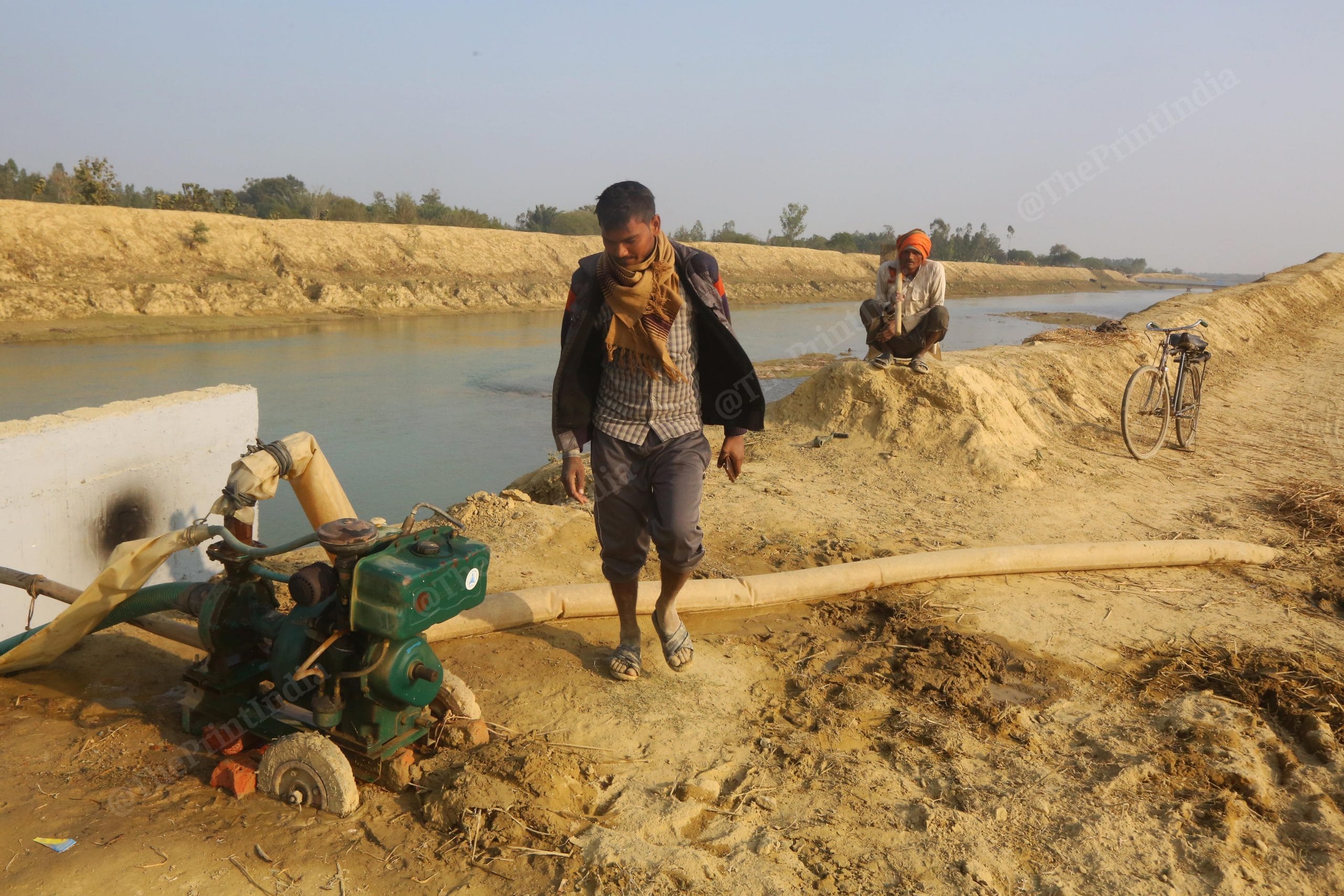 Local villager pumping water through river at Saryu Nahar Pariyojna | Photo: Praveen Jain| ThePrint