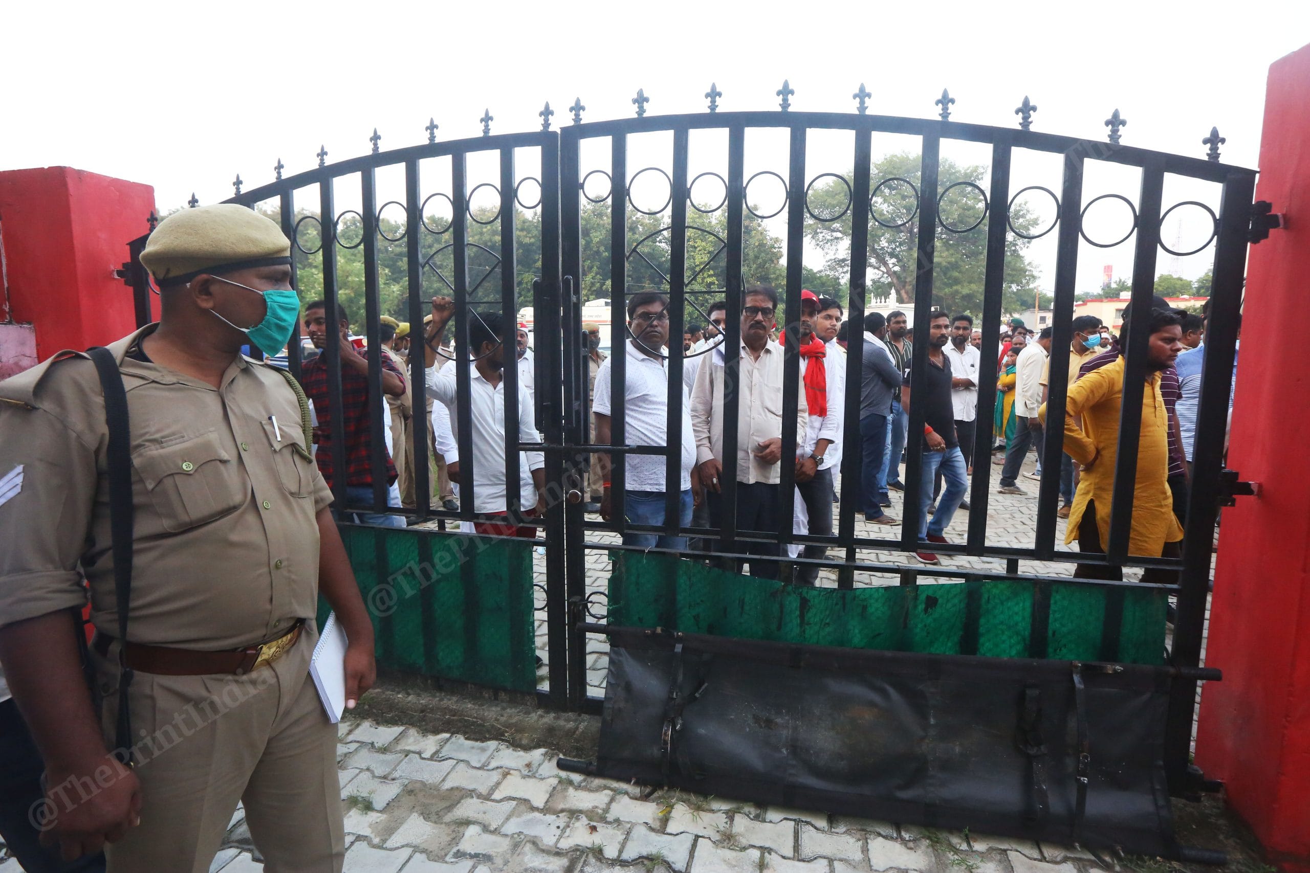 Families of those killed wait outside the mortuary of the district hospital in Lakhimpur Kheri | Photo: Praveen Jain | ThePrint