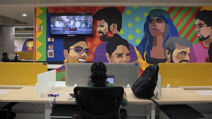 A young worker at her office desk, Bengaluru