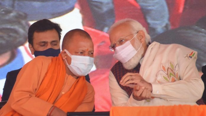 Prime Minister Narendra Modi with UP CM Yogi Adityanath in Shahjahanpur, on 18 December 2021| PTI Photo
