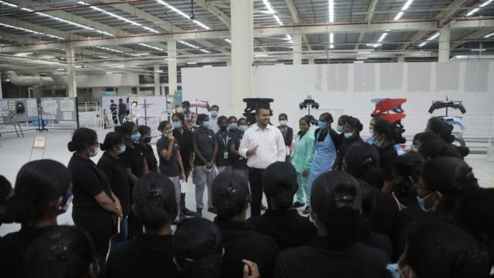 Ola Group CEO and Chairman Bhavish Aggarwal shares a light moment with women staff at the Ola FutureFactory | By Special Arrangement