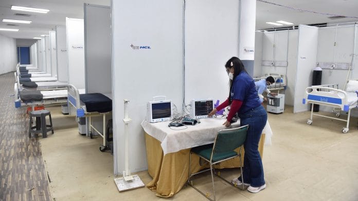 A worker checks a monitor inside a Covid facility at Commonwealth Games Village in view of the Omicron cases, in New Delhi, on 19 December 2021 | PTI Photo
