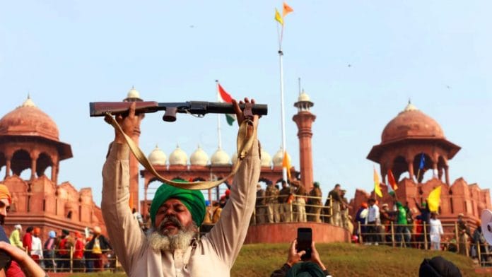 A farmer holds a gun outside Red Fort on 26 January. The protesting farmers carried out a tractor rally to Red Fort on Republic Day. The protest took a violent turn that day amid clashes between police and farmers opposing the farm laws | Photo: Manisha Mondal | ThePrint