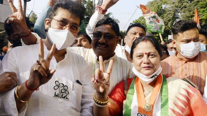 Kajari Banerjee (right) with husband Kartik (centre) and fellow candidate Asim Bose in Kolkata on 27 November. | ANI