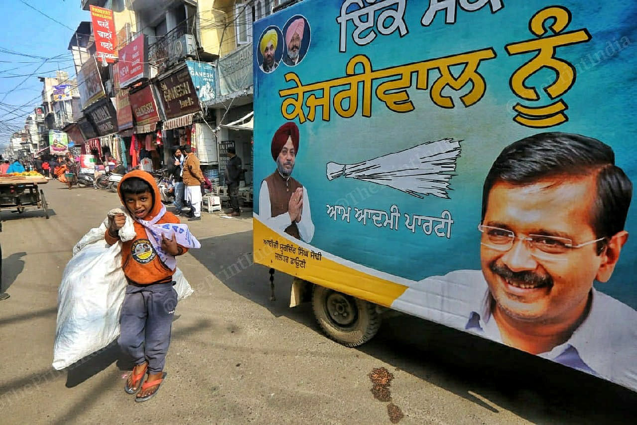 Child Ragpiker passing through the Election van of the Aam Adami party at Jalandhar cantt Bazzar | Praveen Jain | ThePrint