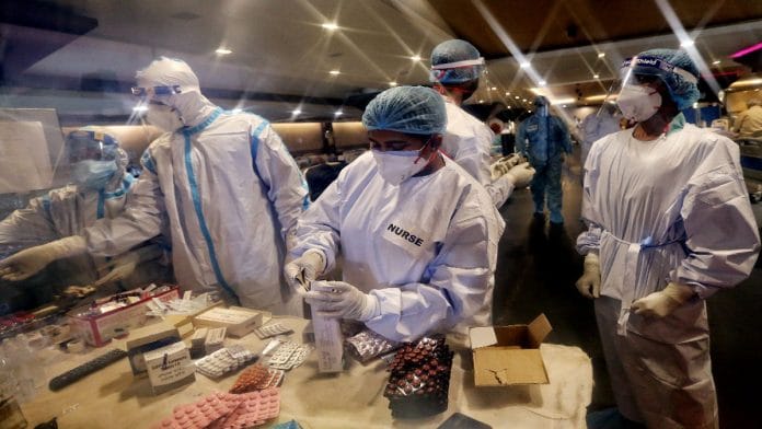 File photo of health workers preparing medicine doses for patients at a Covid centre in New Delhi | ANI