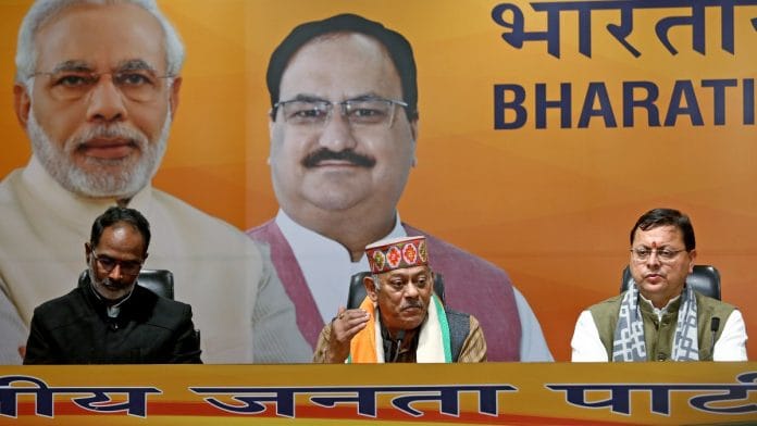 Colonel (Rtd.) Vijay Rawat (middle), brother of CDS Bipin Rawat, joins BJP in the presence of Uttarakhand CM Pushkar Dhami and others, at party headquarters in New Delhi, on 19 January 2022 | ANI photo