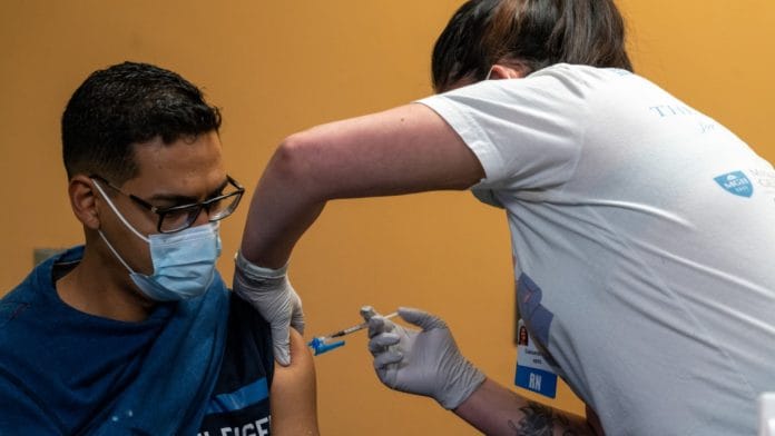 A healthcare worker administers a dose of Pfizer-BioNTech Covid vaccine | Representational image | Bloomberg