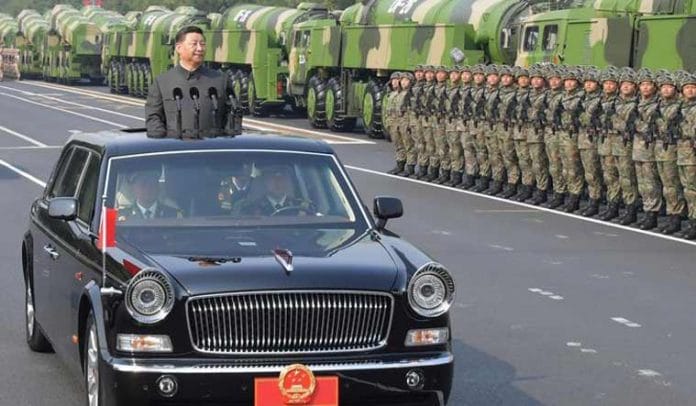 Chinese President Xi Jinping on a Hongqi limousine at a parade in Tienanmen Square in Beijing. | Photo Credit: China Ministry of National Defense