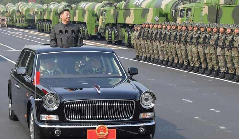 Chinese President Xi Jinping on a Hongqi limousine at a parade in Tienanmen Square in Beijing. | Photo Credit: China Ministry of National Defense