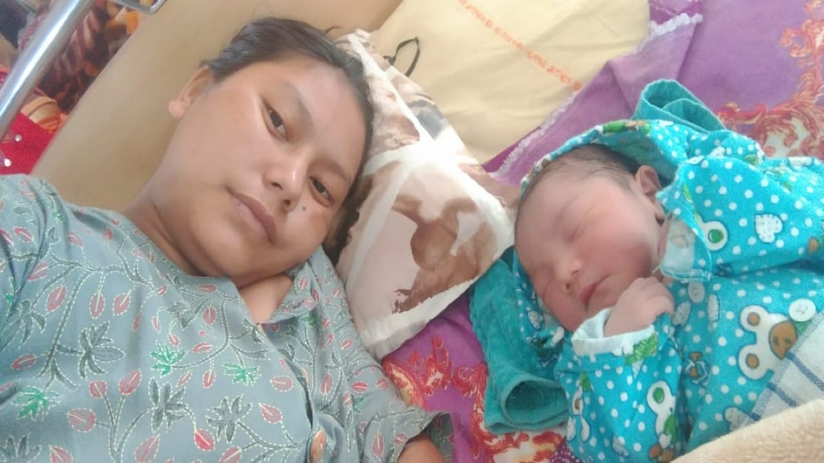 22-year-old villager Pasalam Dupka, who was taken to the 'zero point' by palki while she was in labour Sunday, with her baby | By special arrangement